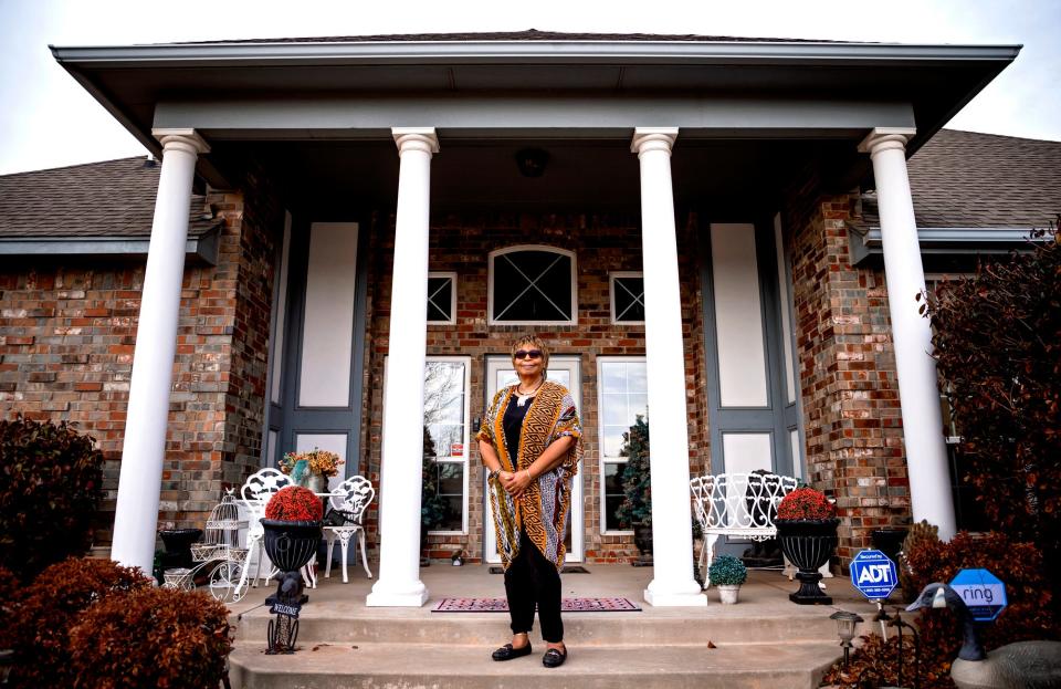 Homeowner Denyvetta Davis poses for a photo March 16, 2021, at her home in the JFK neighborhood, near NE 4 and Bath Avenue in Oklahoma City. Homeowners say the Derichebourg Recycling USA facility is the source of explosions that rattle nerves and houses.