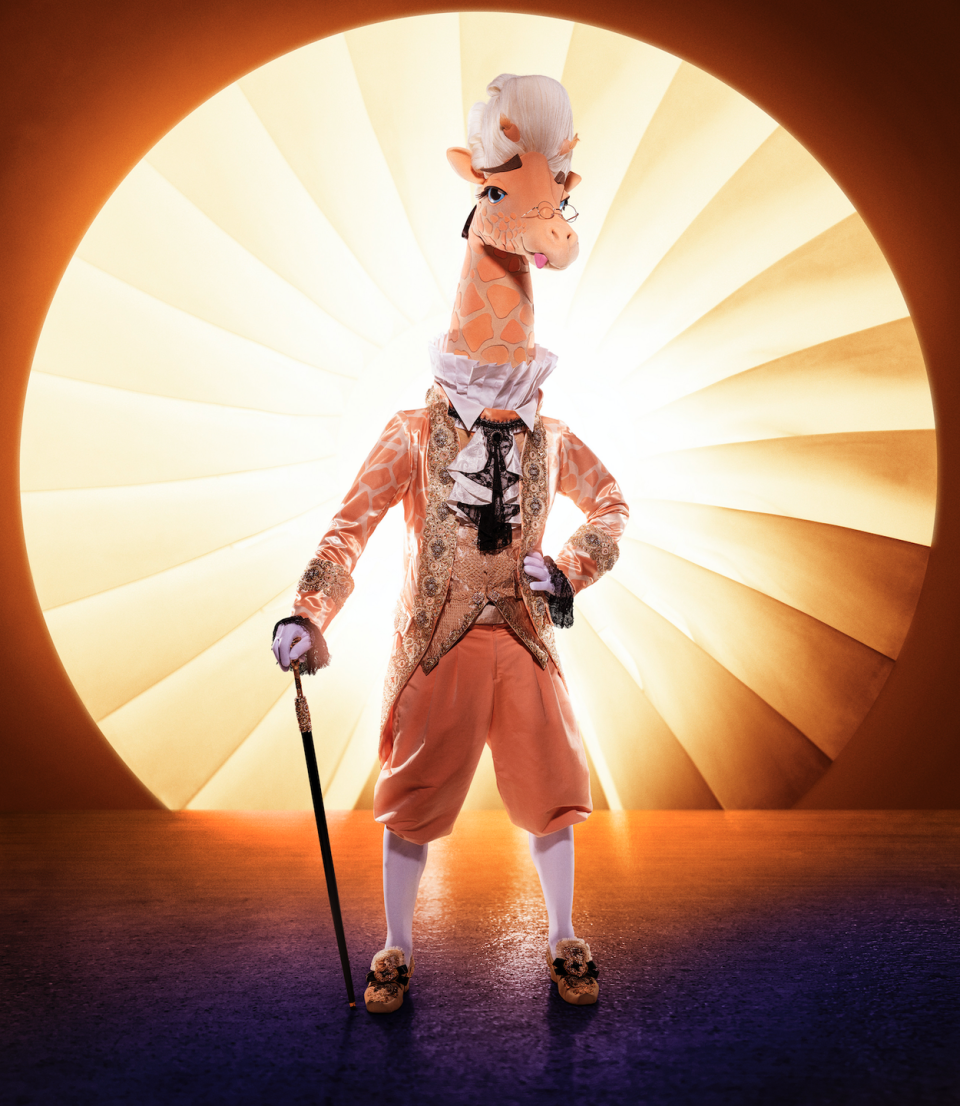 <p><strong><strong><em>The Masked Singer</em> Revealed: </strong></strong>Brian Austin Green</p><p><strong>Clues:</strong></p><p>1) Giraffe wears a fancy wig with couture-inspired jewelry.</p><p>2) Giraffe has a cane, period-appropriate heels, and stockings.This tall mammal is a whopping eight feet tall.</p><p>3) Giraffe “shares something in common with a powerful giant.”</p><p>4) Giraffe says, “America, trying to figure out my identity is going to be a real pain in the neck.”</p><p>5) In the <a href="https://www.youtube.com/watch?v=H2q6IwuPncI" rel="nofollow noopener" target="_blank" data-ylk="slk:first clue package;elm:context_link;itc:0;sec:content-canvas" class="link ">first clue package</a>, Giraffe revealed he’s “had a rollercoaster career full of ups and downs.”</p><p>6) Giraffe has music in his blood, but when he took a risk, he “became the butt of everyone’s jokes.”</p><p>7) Giraffe was also seen next to a $3 sign and driving a bumper car. </p>