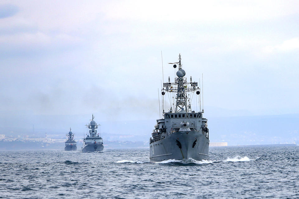 This handout photo released on Wednesday, April 14, 2021 by Russian Defense Ministry Press Service shows, Russian navy ships are seen during navy drills in the Black Sea. Russia has insisted that it has the right to close areas of the Black Sea for foreign naval ships and rejected Ukrainian and Western criticism of the move. (Russian Defense Ministry Press Service via AP)