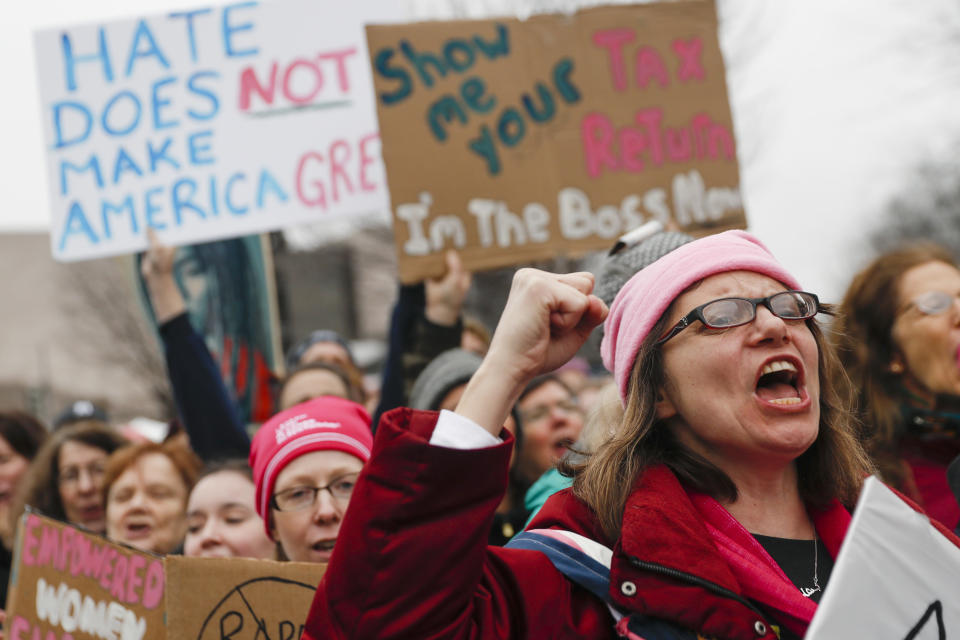 FILE - Protesters cheer at the Women's March on Washington during the first full day of Donald Trump's presidency, Saturday, Jan. 21, 2017 in Washington. (AP Photo/John Minchillo, File)