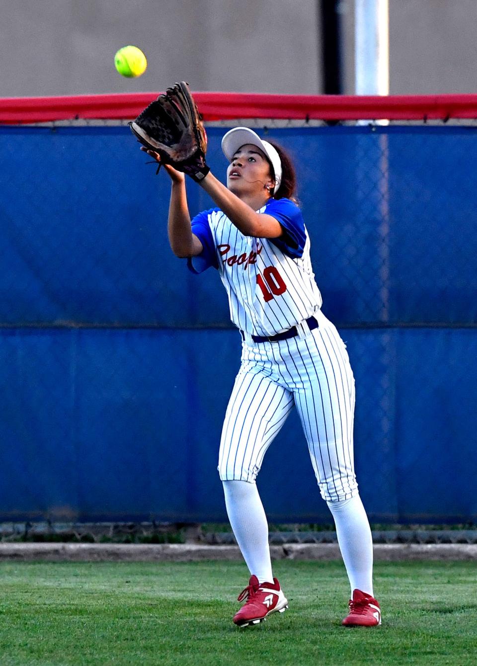 Cooper center fielder Jazlyn Hatcher catches a Lubbock Monterey flyball during Tuesday’s game in Abilene.