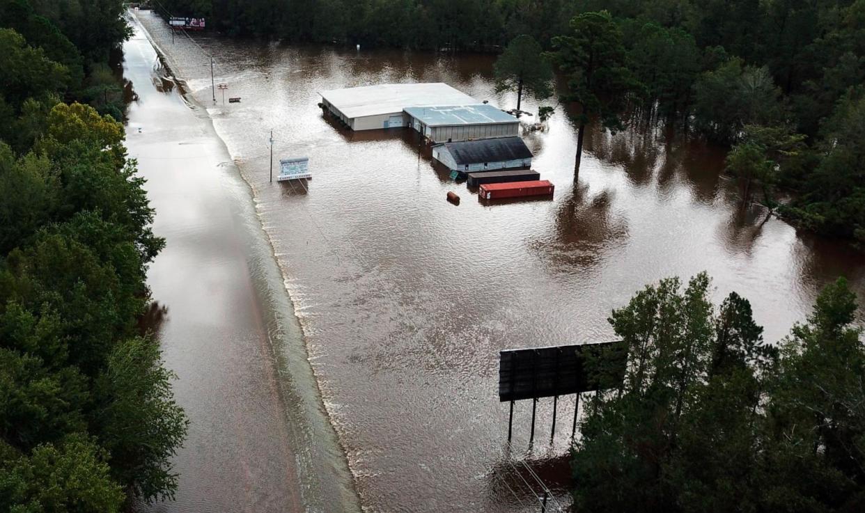 PHOTO: Water from The Little Pee Dee River floods business and washes out part of Rte. 301 on September 17, 2018 in Dillon, S.C. (Ricky Carioti/The Washington Post via Getty Images)