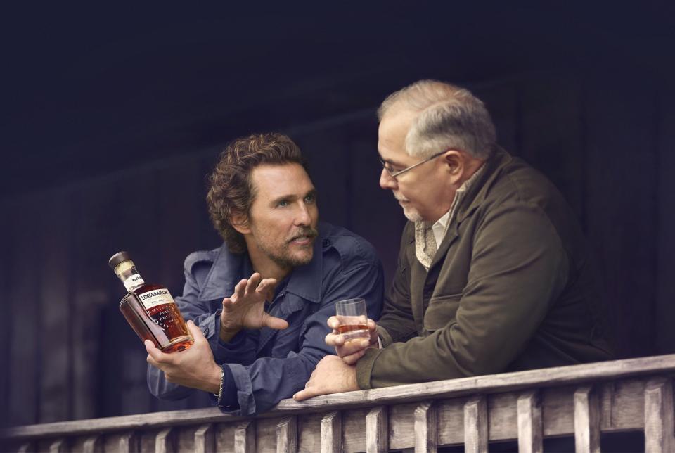 This photo shows Matthew McConaughey talking to&nbsp;<a href="https://wildturkeybourbon.com/product/wild-turkey-longbranch/" target="_blank" rel="noopener noreferrer">Wild Turkey</a>&nbsp;Master Distiller Eddie Russell. <br />I imagine the conversation went something like this:<br />Matthew McConaughey: "You see, I think bourbon would go great in bottles!"<br />Master Distiller Eddie Russell: "Like the one you're holding?"<br />MM: "You're perceptive. And I think the bourbon needs to have alcohol in it."<br />MDER: "You know, bourbon by its very nature already has alcohol in it."<br />MM: "Man, you know your stuff. Alright! Alright! Alright!"