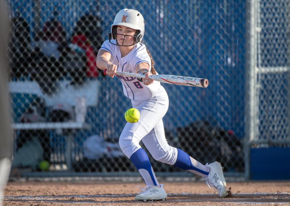 Kimball's Briez Dodds hits a bunt during a girls varsity softball game against Lincoln at Kimball High in Tracy on Mar. 7, 2024. Pamplona was ruled safe. Kimball won 13-7.