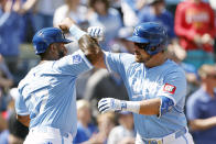 Kansas City Royals' Hunter Renfroe, right celebrates after his two-run home run with Nelson Velázquez (17) during the fifth inning of a baseball game against the Chicago White Sox in Kansas City, Mo., Sunday, April 7, 2024. (AP Photo/Colin E. Braley)