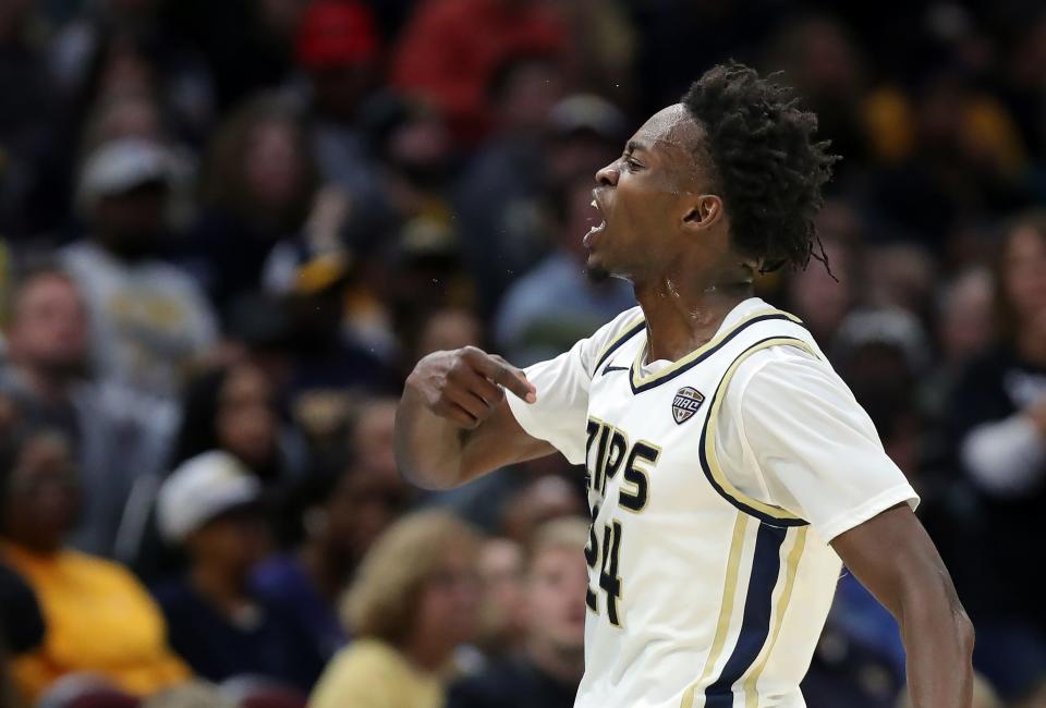 Akron Zips guard Ali Ali (24) celebrates a three during the first half of the Mid-American Conference Tournament championship game at Rocket Mortgage FieldHouse, Saturday, March 16, 2024, in Cleveland, Ohio.