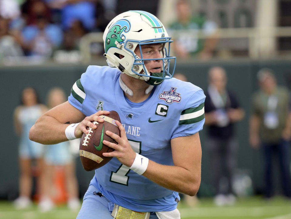 FILE - Tulane quarterback Michael Pratt drops back to throw against Central Florida during the first half of the American Athletic Conference championship NCAA college football game in New Orleans, Dec. 3, 2022. At No. 24, Tulane enters this season as the only team from a mid-major conference in the AP Top 25. And with Pratt returning for a fourth season, the Green Wave is the favorite to win the expanded and somewhat revamped AAC in 2023. (AP Photo/Matthew Hinton, File)