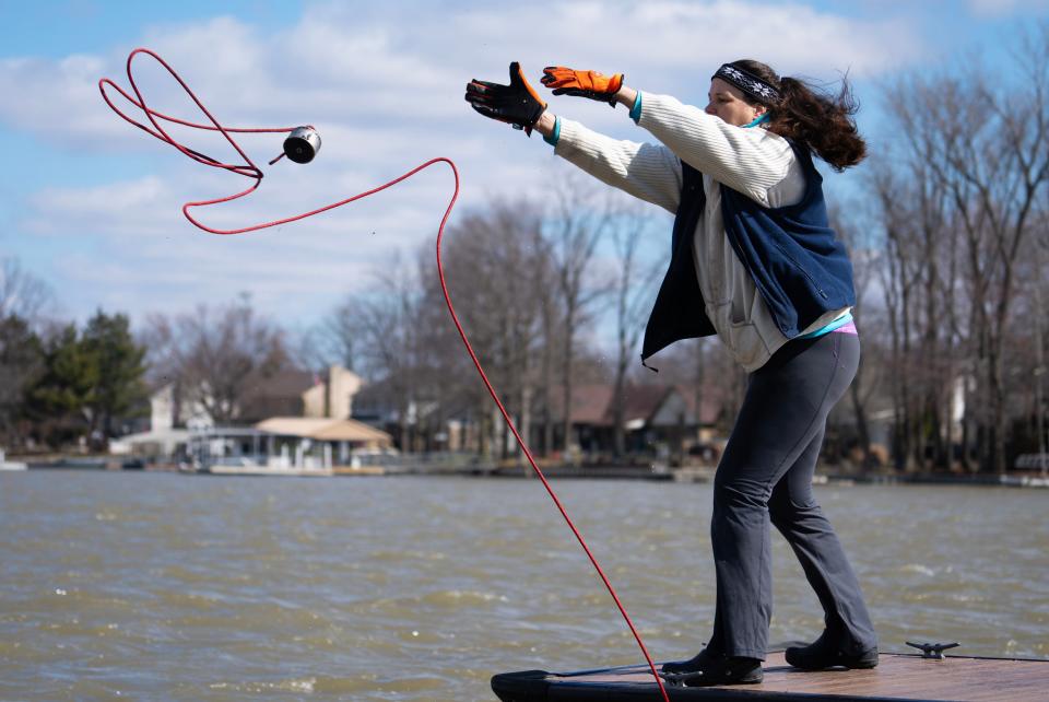 Angel Carbone cast her magnet out Tuesday, March 7, 2023, while fishing for objects hidden under the surface at Morse Beach at Morse Reservoir in Noblesville, Ind. She hauls in unexpected treasures from a Casio watch to foldable lawn chairs, all while helping rid Indiana waterways of trash and toxic metals.