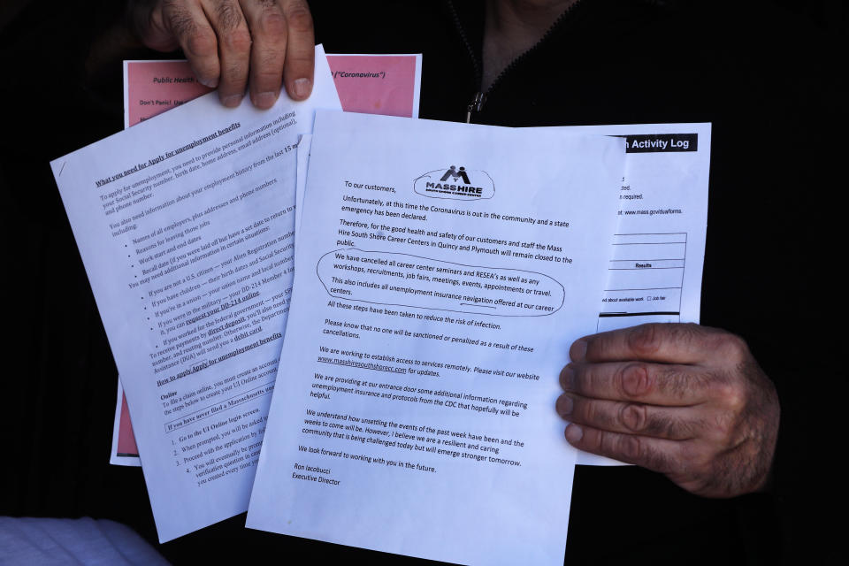 QUINCY, MA - MARCH 26: Anthony Tiro, a former journeyman pipe fitter with Local 537 Boston, show spaperwork he received when he went to the Mass Hire South Shore Career Center in Quincy, MA on March 26, 2020. Staff there would not listen to his questions. He has attempted and failed to log in to an account with the Department of Unemployment Assistant due to a password glitch. He was laid off from his job and has listened to a scheduled webinar by the DUA four times. (Photo by Pat Greenhouse/The Boston Globe via Getty Images)