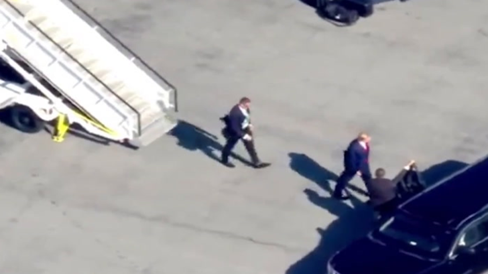 Donald Trump exits his 757 at New York’s La Guardia Airport and is met by Secret Service agents. (Reuters)