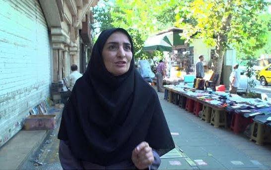 Fatemeh, a medical advisor, speaks with CBS News on a street in Tehran, Iran, in early September 2023. / Credit: CBS News