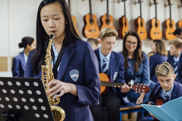 Pupils playing musical instruments