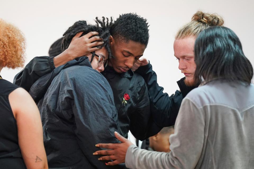 People comfort each other after a vigil for a group of Americans recently kidnapped in Mexico, at Word of God Ministries in Scranton, S.C., on March 8, 2023. Two of the four Americans, all from South Carolina, were killed after being caught in a deadly shootout while traveling the week before to Matamoros for one of them to get cosmetic surgery.