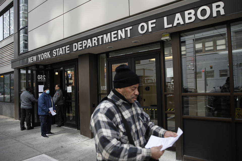 Visitors to the Department of Labor March 18 are turned away at the door by personnel due to closures over coronavirus concerns in New York. A record-high number of people applied for unemployment benefits as layoffs engulfed the United States. (Photo: ASSOCIATED PRESS)