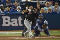 Oct 17, 2016; Toronto, Ontario, CAN; Cleveland Indians second baseman Jason Kipnis (22) hits a solo home run against Toronto Blue Jays catcher Russell Martin (55) during the sixth inning in game three of the 2016 ALCS playoff baseball series at Rogers Centre. Mandatory Credit: Dan Hamilton-USA TODAY Sports