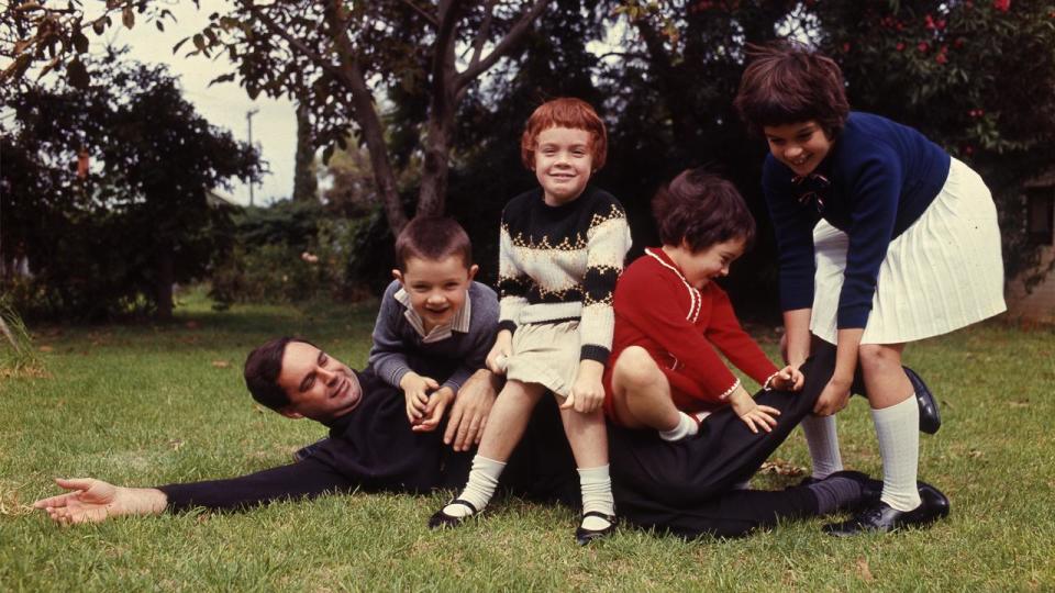 Steele Hall playing with his children (file image)