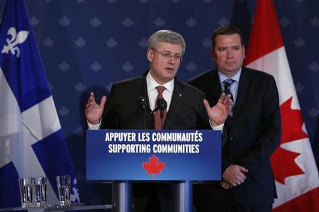 Canada's Prime Minister Harper gestures as he speaks during a news conference in Frontenac