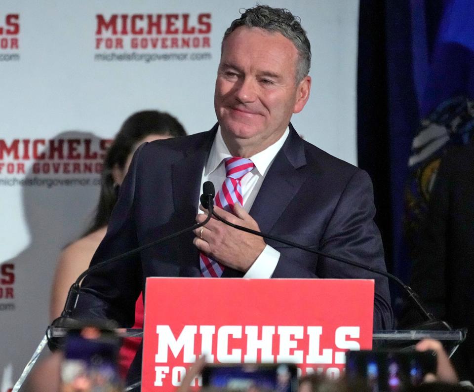 Tim Michels acknowledges his supporters as he gives his concession speech during his election night party early Wednesday at the Italian Community Center in Milwaukee. Michels was trailing Gov. Tony Evers by three percentage points when he conceded the race.