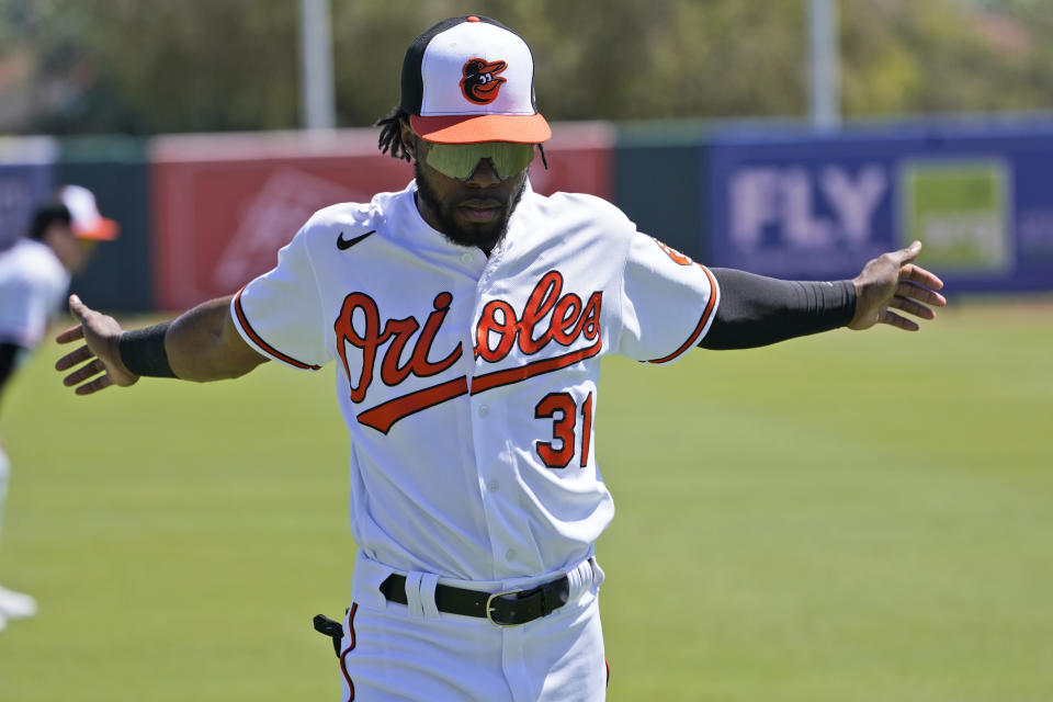 Baltimore Orioles outfielder Cedric Mullins (31) warms up prior to the start of spring training baseball game against the Minnesota Twins at Ed Smith Stadium, Monday, March 21, 2022, in Sarasota, Fla. (AP Photo/Steve Helber)