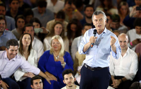 Argentina's President Mauricio Macri speaks in front of Buenos Aires province governor Maria Eugenia Vidal, Lower House candidate Elisa Carrio and Buenos Aires' city Mayor Horacio Rodriguez Larreta during a campaign rally ahead of mid-term elections in Buenos Aires, Argentina October 17, 2017. REUTERS/Marcos Brindicci