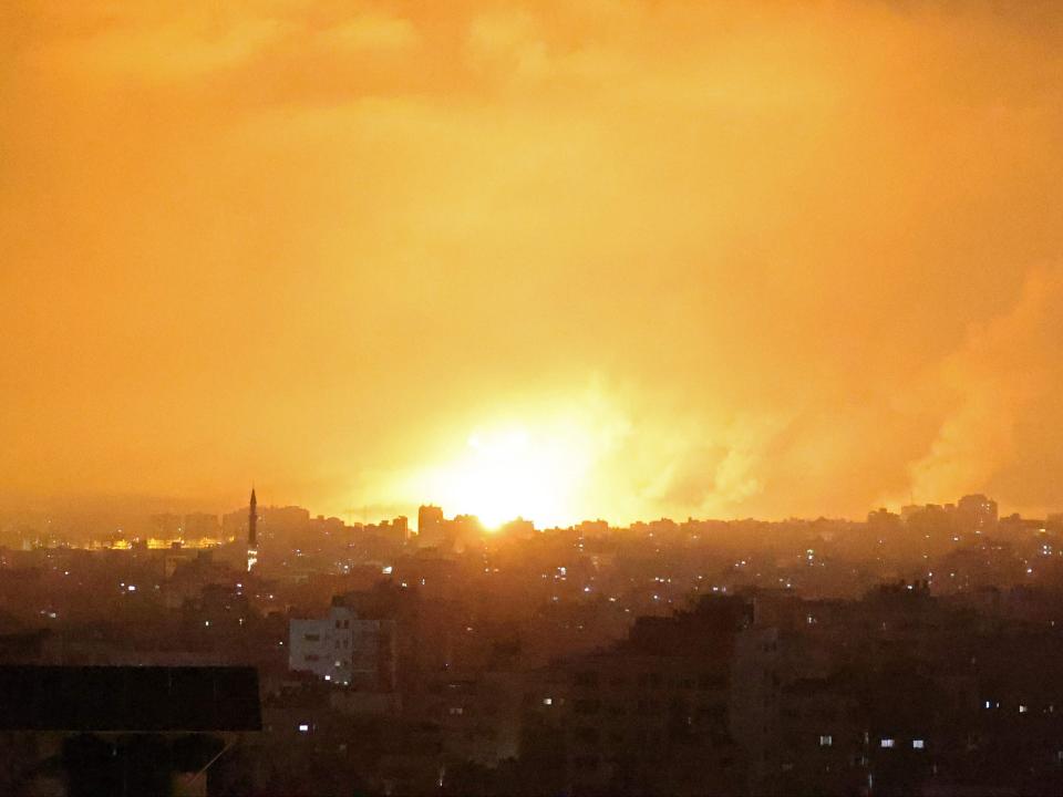 An explosion lights the sky following an Israeli air strike on Beit Lahia in the northern Gaza Strip (MOHAMMED ABED/AFP via Getty Images)