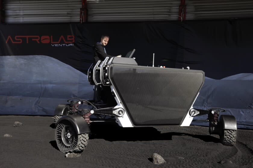 HAWTHORNE, CA - MARCH 9, 2022 - - Jaret Matthews, CEO & Founder of Astrolab, test drives a FLEX rover over ground-up basalt at Astrolab's headquarters in Hawthorne on March 9, 2022. Astrolab's working prototype of its FLEX rover, is a vehicle that can be driven semi-autonomously, autonomously or with a human at the wheel, on the moon. It was developed by Astrolab, a company founded and staffed by former SpaceX and JPL employees who worked on the Mars rover and on SpaceX's Crew Dragon capsule. (Genaro Molina / Los Angeles Times)