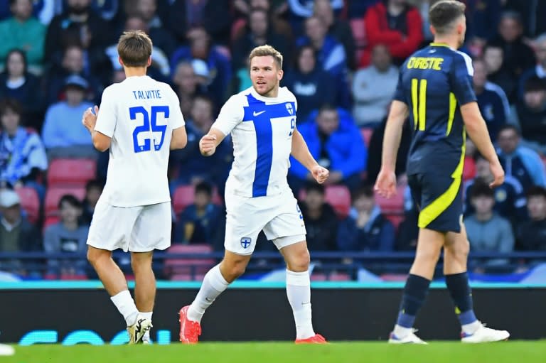 Finland striker Benjamin Kallman (centre) celebrates his goal against Scotland (ANDY BUCHANAN)