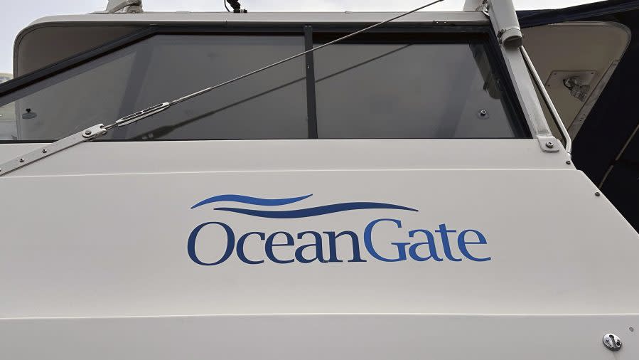 The logo for OceanGate Expeditions is seen on a boat parked near the offices of the company at a marine industrial warehouse office door in Everett, Wash., Tuesday, June 20, 2023. (AP Photo/Ed Komenda)