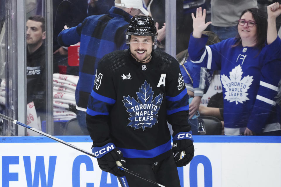 Toronto Maple Leafs forward Auston Matthews (34) smiles after scoring against the Florida Panthers during the third period of an NHL hockey game in Toronto on Wednesday, March 29, 2023. (Nathan Denette/The Canadian Press via AP)