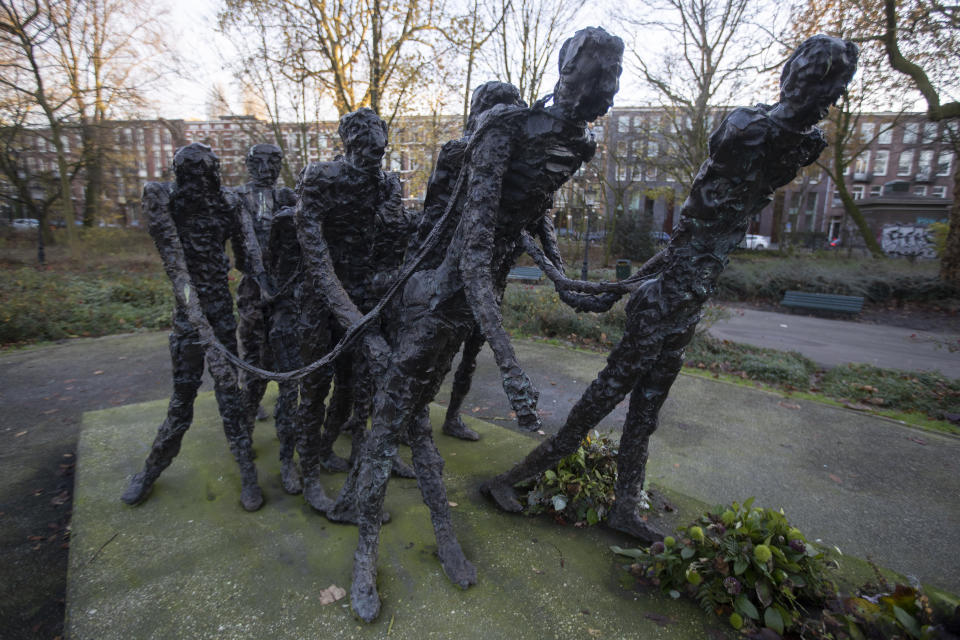 FILE - The National Monument Slavery Past by Erwin de Vries in Amsterdam, Netherlands is seen in this Dec. 10, 2020 file photo. The Netherlands is expected to issue a national apology for its brutal slavery past when Dutch officials visit their former Caribbean colonies in late Dec. 2022. (AP Photo/Peter Dejong, File)