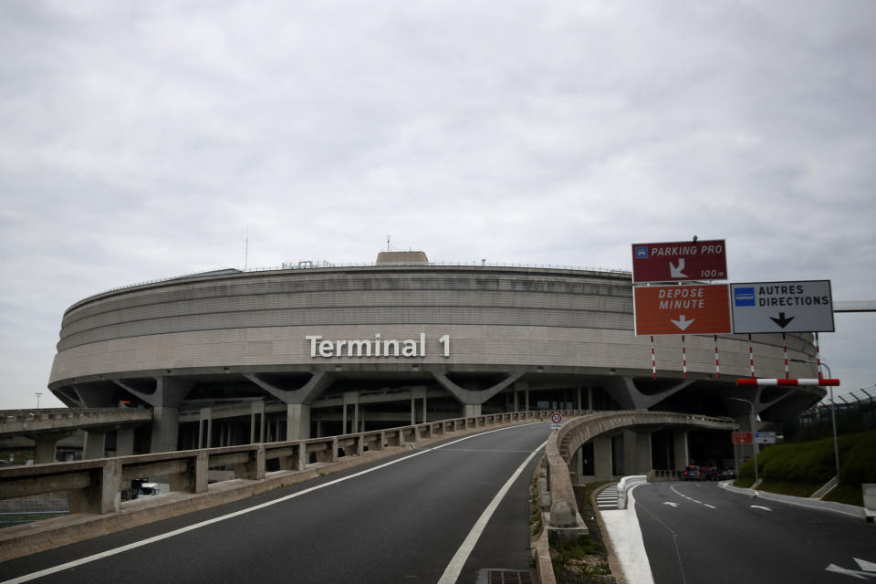 FILE - The terminal 1 of Charles de Gaulle airport is pictured in Roissy, near Paris, Friday, May 17, 2019. An express train that would whisk visitors from Paris' main international airport, Charles de Gaulle, to the city center in 20 minutes is not now slated to open before 2027. (AP Photo/Christophe Ena, File)