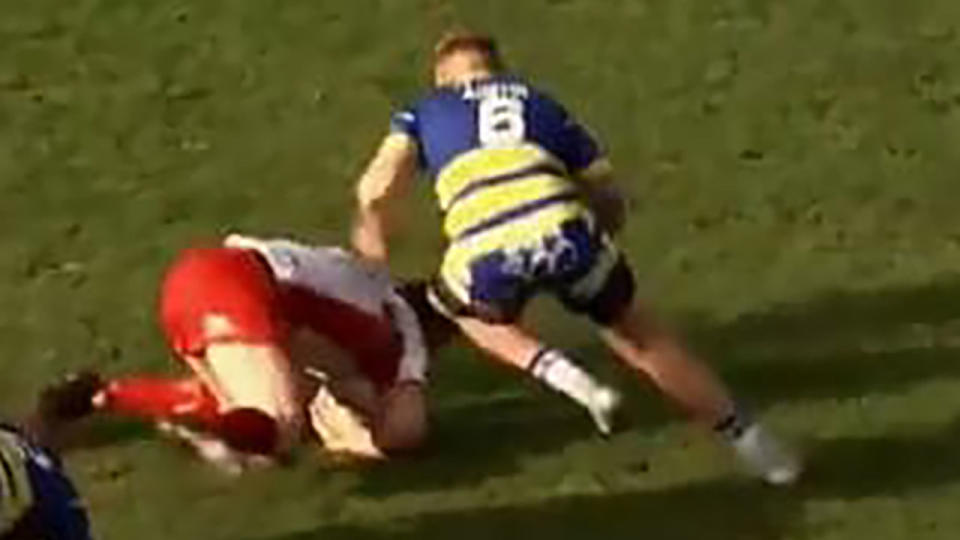 Blake Austin tackles Joel Tomkins.