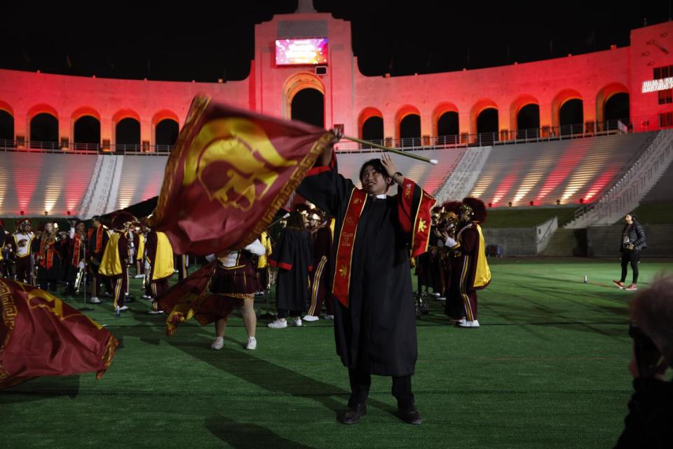Jerico Dimataga, a member of the USC Silks, performs at the "Trojan Family Graduate Celebration," at The Coliseum on May 9.