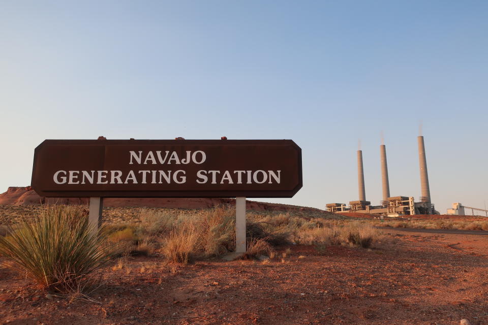 This Aug. 19, 2019, image shows the coal-fired Navajo Generating Station near Page, Ariz. The power plant will close before the year ends, upending the lives of hundreds of mostly Native American workers who mined coal, loaded it and played a part in producing electricity that powered the American Southwest. (AP Photo/Felicia Fonseca)