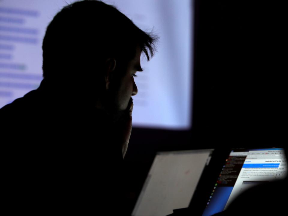 FILE PHOTO: A man takes part in a hacking contest during the Def Con hacker convention in Las Vegas, Nevada, U.S. on July 29, 2017.