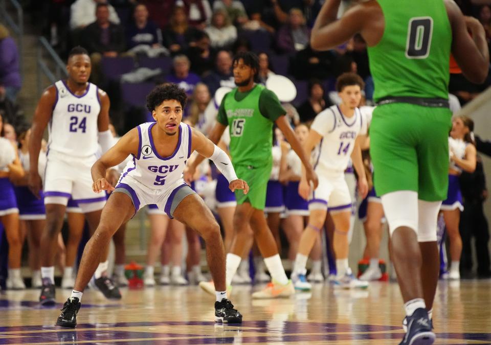 Dec 30, 2021; Phoenix, AZ, United States; GCU's Jalen Blackmon (5) defends against Chicago State's Jameon Harris (0) during a game at GCU.