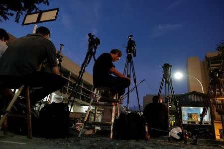 Media personnel gather outside the morgue at Kuala Lumpur General Hospital, where the body of Kim Jong Nam is held for autopsy in Malaysia, February 17, 2017. REUTERS/Athit Perawongmetha