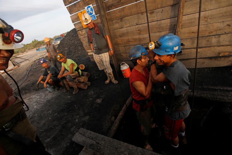 The Wider Image: Deep underground, Mexican coal miners remember those who never came back