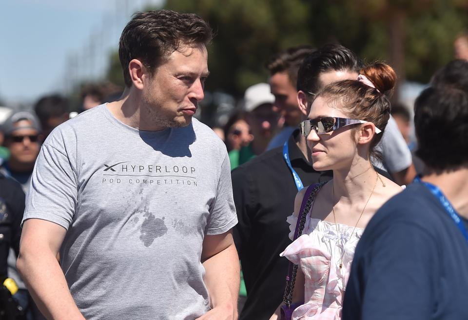 elon and grimes outside