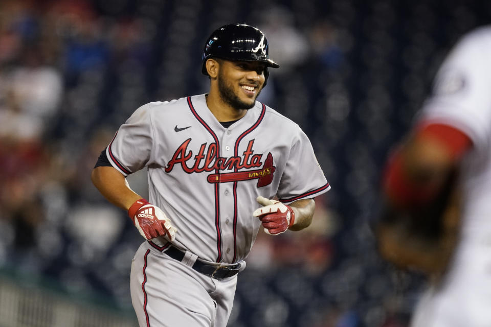 Atlanta Braves' Huascar Ynoa smiles as he runs the bases for his grand slam during the sixth inning of baseball game against the Washington Nationals at Nationals Park, Tuesday, May 4, 2021, in Washington. (AP Photo/Alex Brandon)