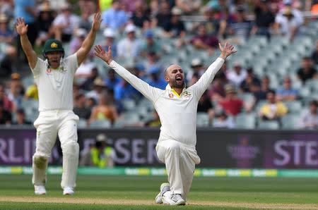 Australia's bowler Nathan Lyon appeals for the wicket of India's batsman Cheteshwar Pujara before having the dismissal overturned by DRS review on day three of the first test match between Australia and India at the Adelaide Oval in Adelaide, Australia, December 8, 2018. AAP/Dave Hunt/via REUTERS