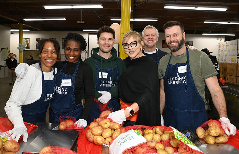 (L-R) Karen Pittman, Adina Porter, Ronen Rubinstein, CEO of Feeding America Claire Babineaux-Fontenot, Tate Donovan and Taran Killam attend Feeding America Hosts Volunteering Opportunity At Los Angeles Regional Food Bank For National Volunteer Month at Los Angeles Regional Food Bank on April 05, 2024 in Los Angeles, California.