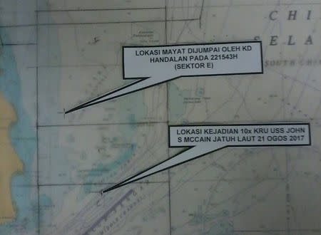 An arrow on the map points to Sector E where a body was found during a search and rescue operation for survivors of the USS John S. McCain ship collision in Malaysian waters in this undated handout released August 22, 2017. Royal Malaysian Navy Handout via REUTERS