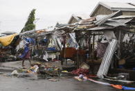 <p>A resident looks at market stalls destroyed by strong winds as Typhoon Mangkhut barreled across Tuguegrao city in Cagayan province, northeastern Philippines on Saturday, Sept. 15, 2018.<br>The typhoon slammed into the Philippines northeastern coast early Saturday, it’s ferocious winds and blinding rain ripping off tin roof sheets and knocking out power, and plowed through the agricultural region at the start of the onslaught.<br>(Photo by Aaron Favila, AP) </p>