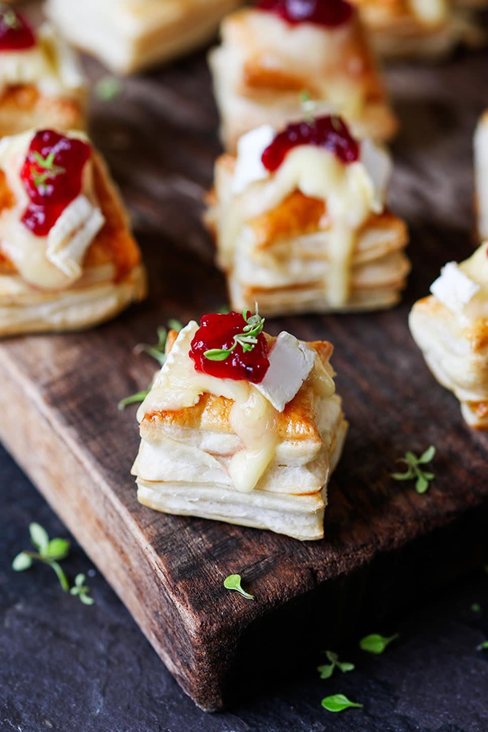 <p>You better double the recipe for this elegant cheesy appetizer, which is guaranteed to be a crowd favorite.</p><p><strong>Get the recipe at <a href="https://www.kitchensanctuary.com/2015/12/cranberry-brie-bites/" rel="nofollow noopener" target="_blank" data-ylk="slk:Kitchen Sanctuary;elm:context_link;itc:0;sec:content-canvas" class="link ">Kitchen Sanctuary</a>. </strong></p>