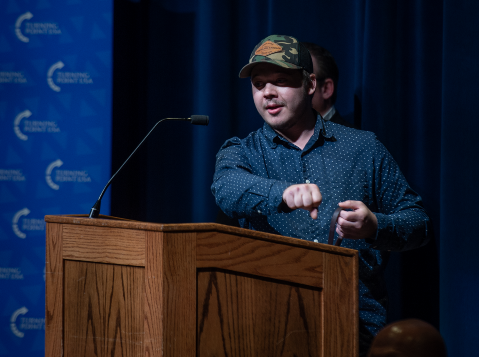 Kyle Rittenhouse speaks to the nearly full auditorium at Kent State University's student center on Tuesday.