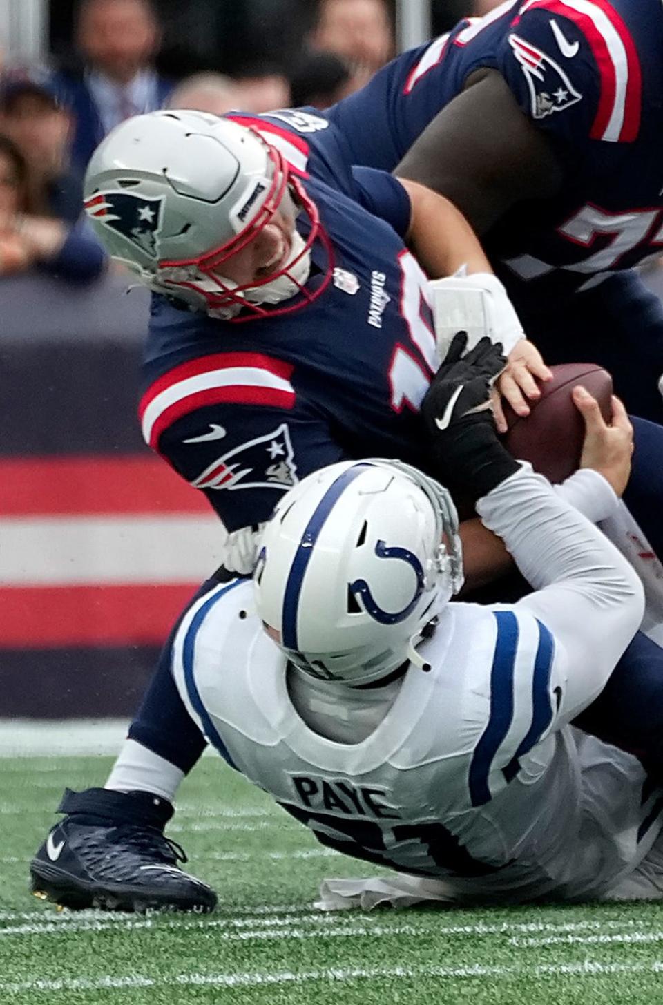 Former Hendricken player, Kwity Paye, of the Indianapolis Colts pulls down Patriots QB Mac Jones for a first half sack.  