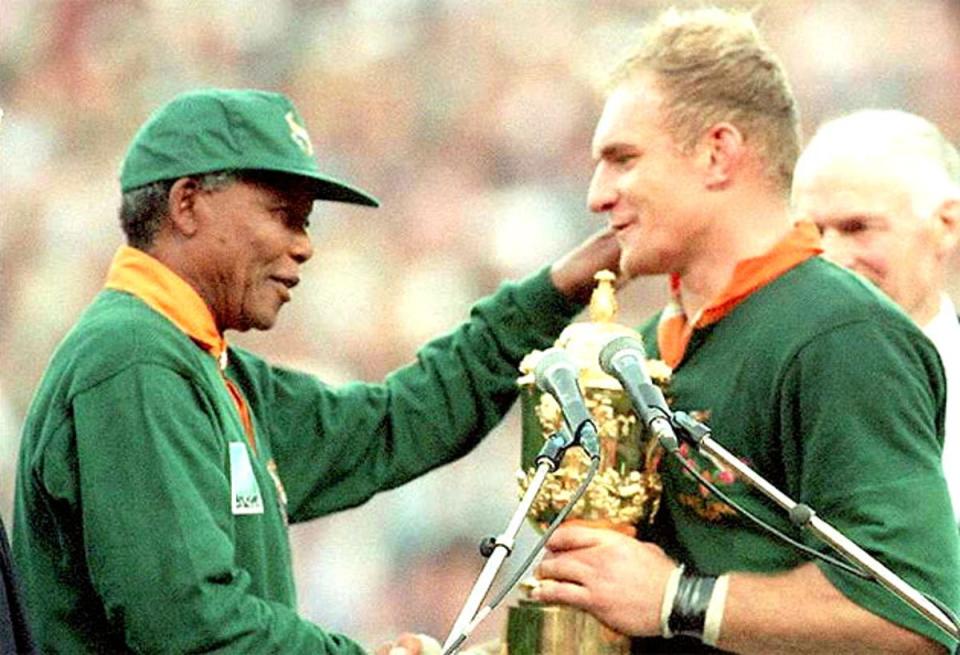 Nelson Mandela presenting Francois Pienaar with the World Cup trophy in 1995 is rugby’s most iconic image (AFP)