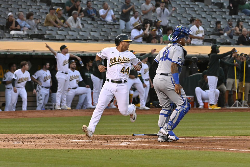 Oakland Athletics catcher Carlos Perez (44) scores against the Kansas City Royals during the third inning of a baseball game in Oakland, Calif., Tuesday, Aug. 22, 2023. (AP Photo/Nic Coury)