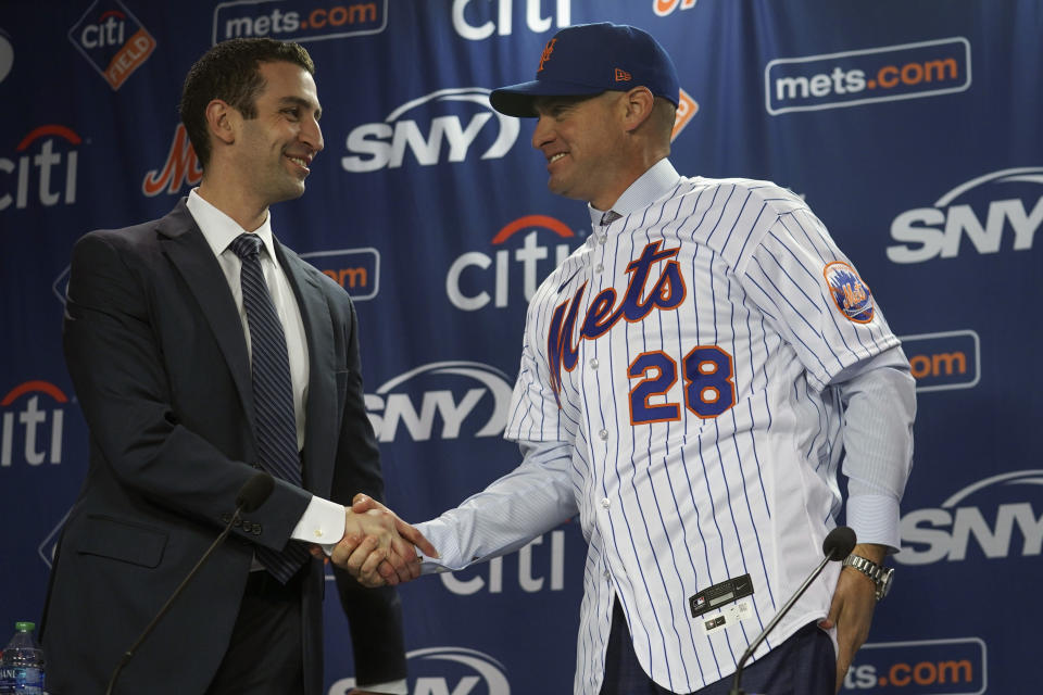 New York Mets president of baseball operations David Stearns, left, introduce new Mets manager, Carlos Mendoza, Tuesday, Nov. 14, 2023, at Citifield in New York. (AP Photo/Bebeto Matthews)